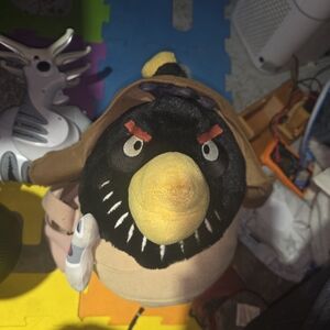 Stuffed Animal with Yellow Beak and Black Body